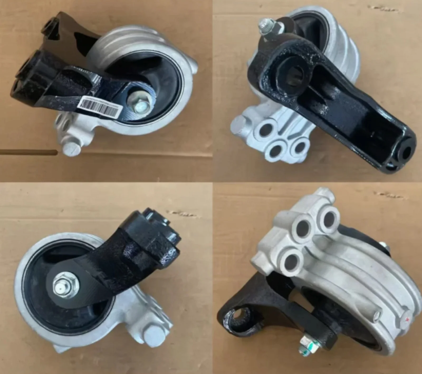 Four caster wheel components laid out on cardboard